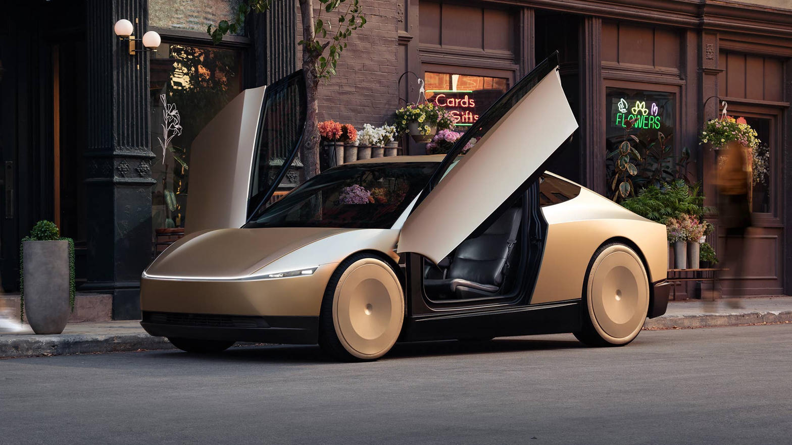 Gold Tesla Cybercab with falcon-wing doors open on a city street
